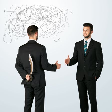 ruthless-businessman-hiding-weapon-weaving-plan-243157672 Ruthless businessman hiding a weapon and weaving plan around his head