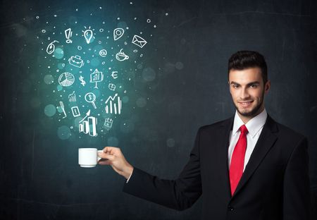 Businessman standing and holding a white cup with business icons coming out of the cup