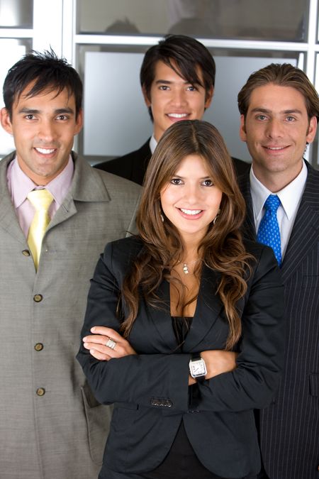 Small group of business people in an office smiling