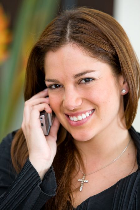 Business female talking on her mobile phone