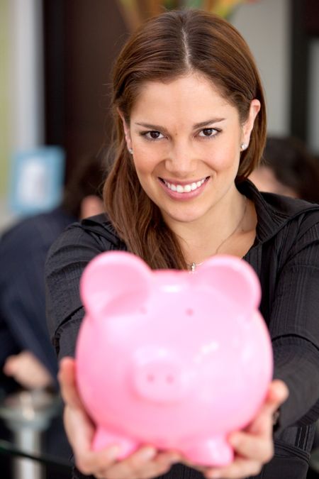 business savings of a woman with a piggy bank