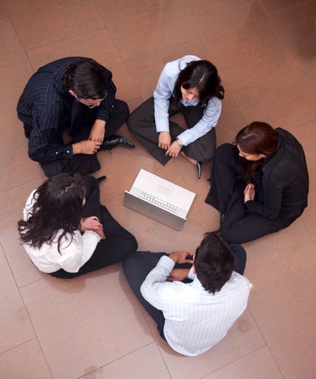Businesspeople sitting in a circle at the office