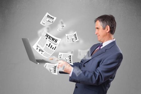 handsome-middle-aged-businessman-holding-notebook-244814866 Handsome middle aged businessman holding notebook and reading the explosive newspaper