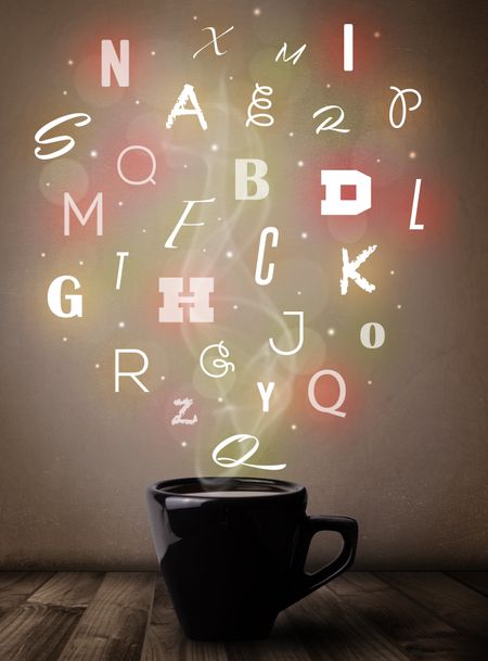 Coffee cup with colorful letters, close up