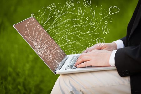 Man pressing notebook laptop computer with doodle icon media cloud symbols 