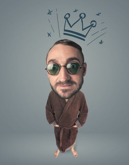 Funny guy with big head and drawn crown over it 