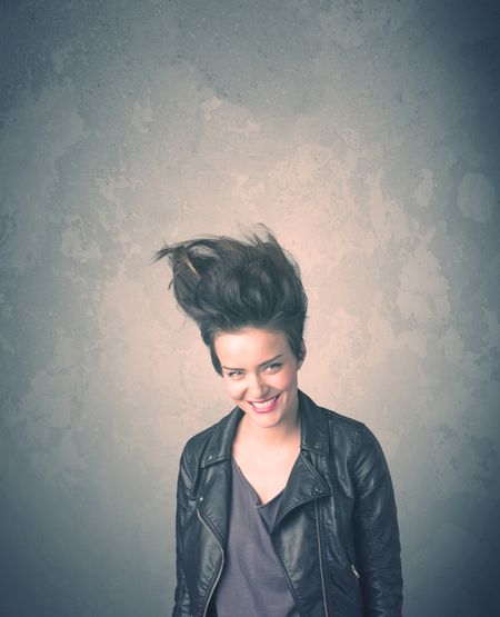 Extreme hair style young woman portrait on vintage background