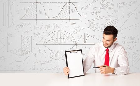 Business man sitting at white table with hand drawn calculations background