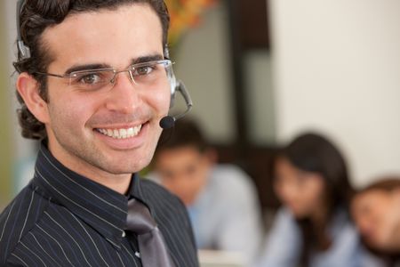 male support operator smiling in an office