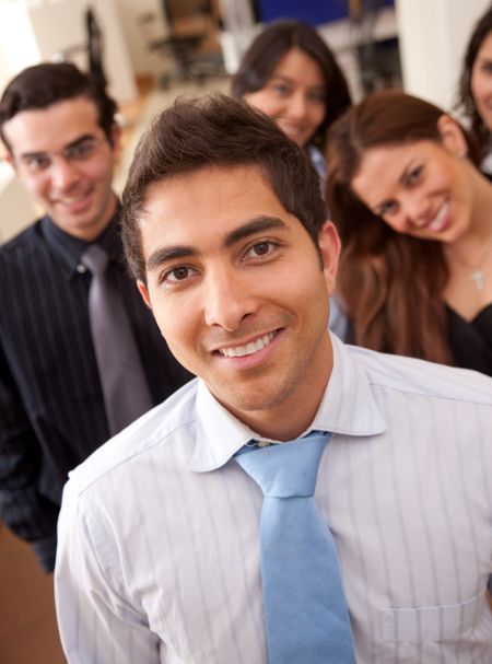 Businessman in an office with his team