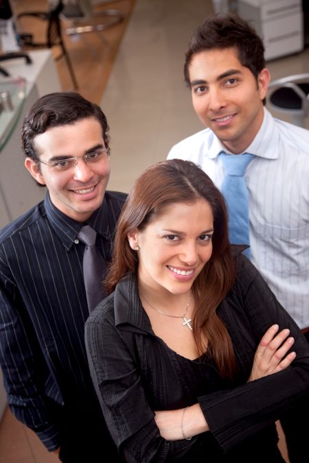 Business partners standing at an office smiling