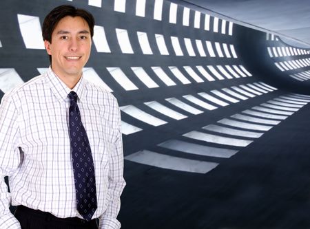 business man portrait in a corporate environment - smiling ove a white background