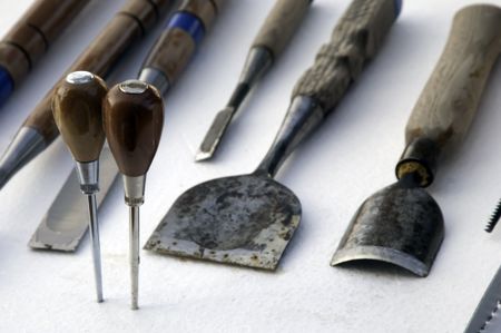 Hand tools of an ice sculptor (focus on handles of ice picks)