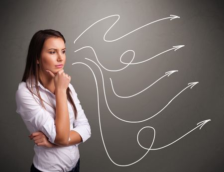 Attractive young teenager looking at multiple curly arrows