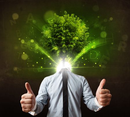 Man with green tree head concept on brown background