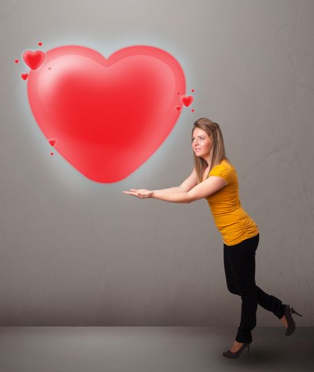 Beautiful young lady holding lovely 3d red heart