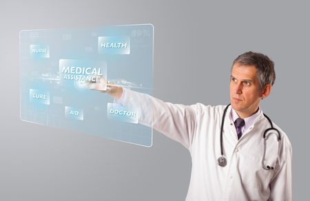 Middle aged doctor standing and pressing modern medical type of button