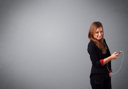 pretty young lady singing and listening to music with copy space