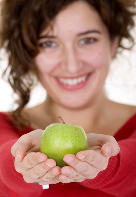girl on a healthy diet smiling - focus is on apple