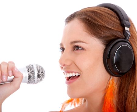 Woman with a microphone and headphones isolated
