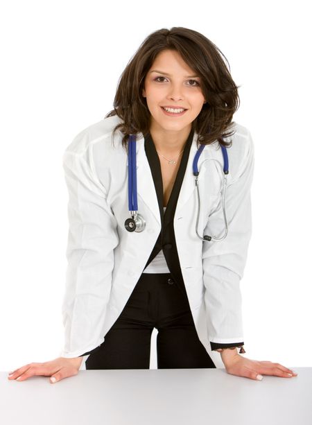 Friendly female doctor smiling isolated over a white