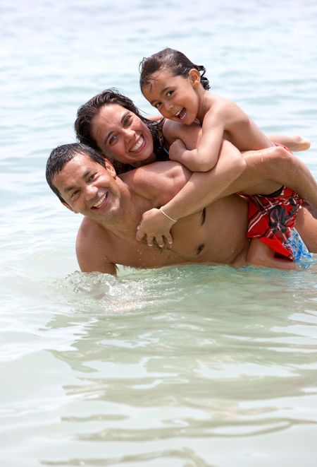 Happy family having fun in the sea