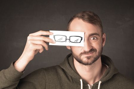 Happy guy looking with paper hand drawn eye glasses concept