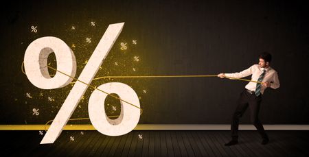 Business man pulling rope with big procent symbol sign concept on background