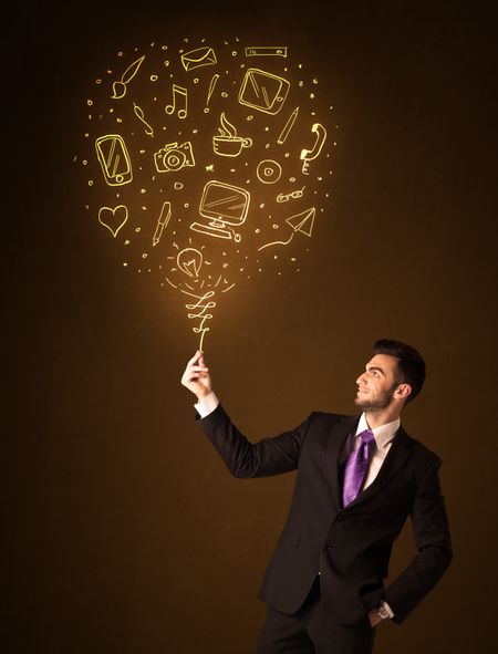 Businessman holding a social media shining balloon on a brown background