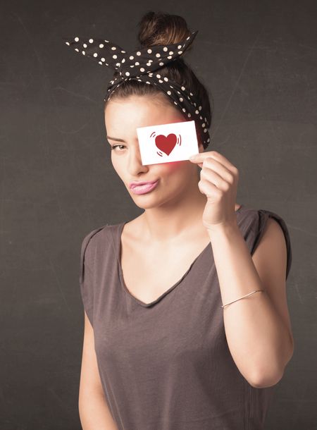 pretty-girl-holding-paper-red-heart-258773981 Pretty girl holding paper with red heart drawing concept
