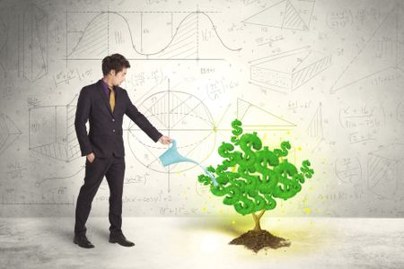Business man watering a growing green dollar sign tree concept