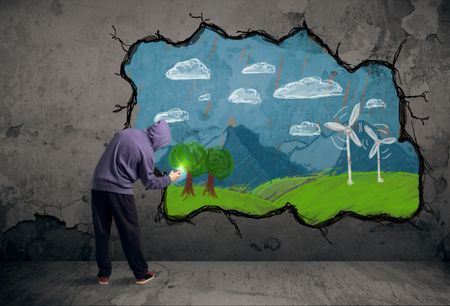 Young urban painter drawing colorful future image on the wall