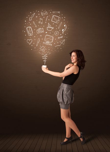 Businesswoman standing and holding a white cup with drown social media icons coming out of the cup