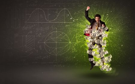 Cheerful businesman jumping with dollar banknotes around him on background