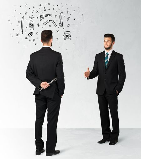 ruthless-businessman-handshake-hiding-weapon-weapon-260684189 Ruthless businessman handshake with hiding a weapon and weapon symbols around his head