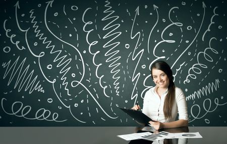 Businesswoman sitting at table with drawn curly lines and arrows on the background