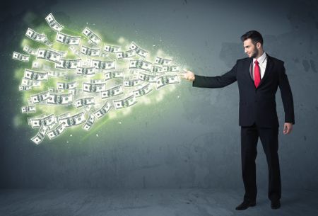 Business person throwing a lot of dollar bills concept on background