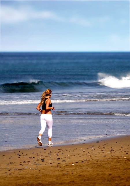 beach female jogger on a sunny day