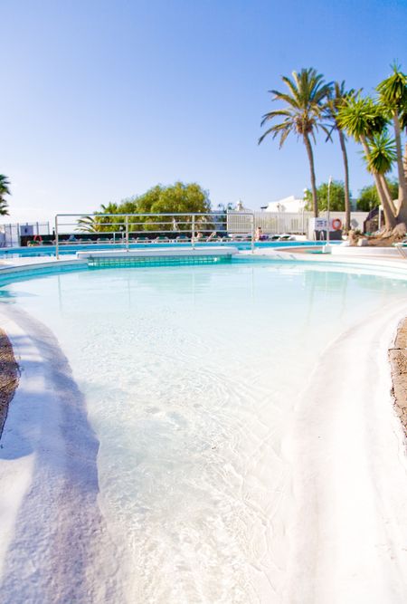 swimming pool in a resort or villa on a sunny day