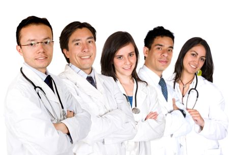 friendly young doctors smiling over a white background - focus is on the male doctor on the left