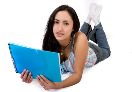 casual student reading a book on the floor over a white background