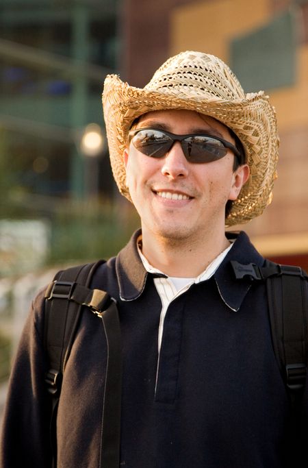 latin american man portrait wearing a hat outdoors