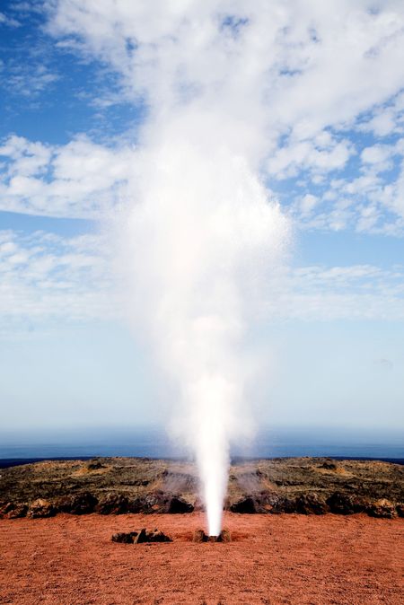 hole spraying water from inside due to the heat of the ground