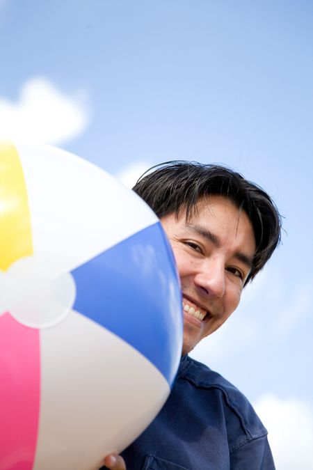 guy appearing from the side of a beach ball - focus is on the face