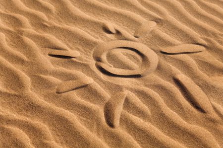 sun shape on a sandy beach