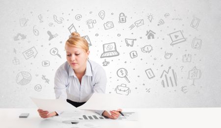 business-woman-sitting-table-hand-drawn-264468290 Business woman sitting at table with hand drawn media icons and symbols