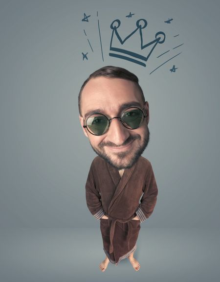 Funny guy with big head and drawn crown over it 