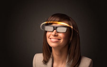 Pretty woman looking with futuristic high tech glasses concept