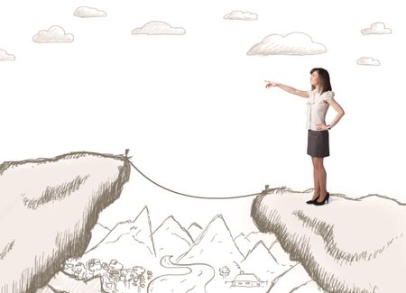 Businesswoman standing on the hand drawn edge of mountain
