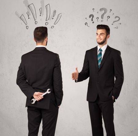 Ruthless businessman handshake with drawn exclamation and question marks around them head